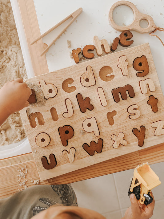 Natural lower case letter wooden puzzle for early learning, enhancing fine motor skills in children.