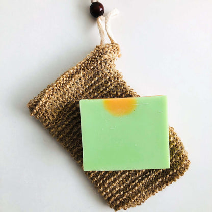 Natural organic jute soap bag with green handmade soap, perfect for zero waste hygiene.