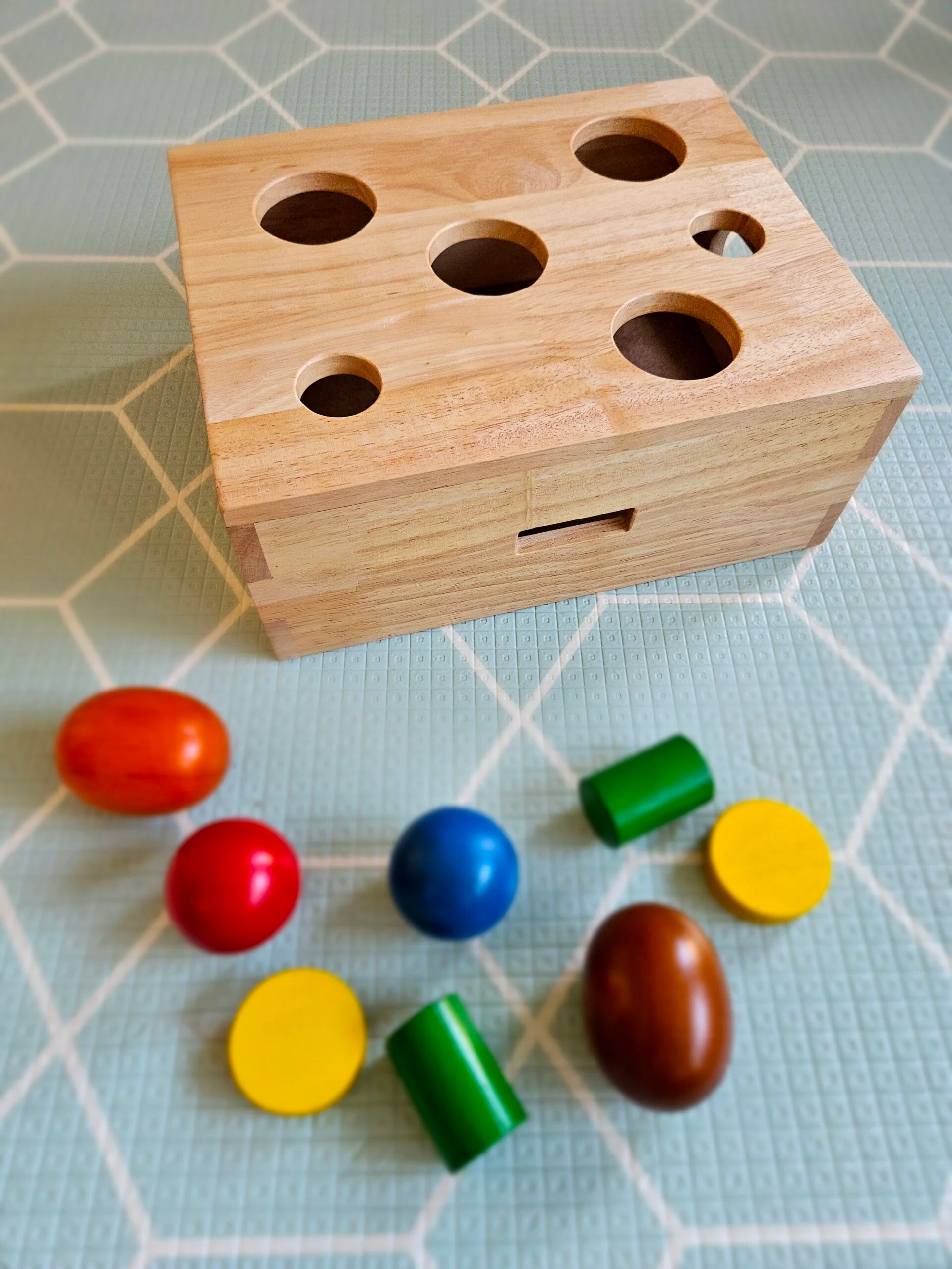 Peek-a-Boo Sorting Box with colorful shapes for kids’ learning and fine motor skills development.