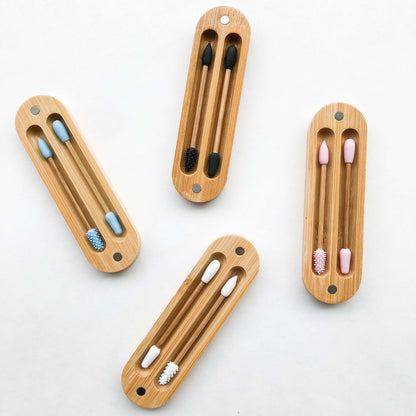 Set of reusable bamboo silicon Q-tips in eco-friendly bamboo cases, environmentally sustainable and plastic-free.