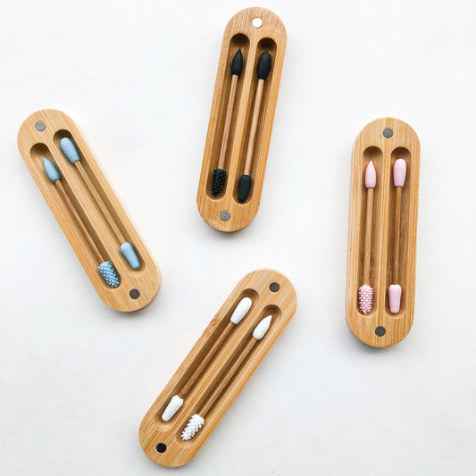 Set of reusable bamboo silicon Q-tips in eco-friendly bamboo cases, environmentally sustainable and plastic-free.